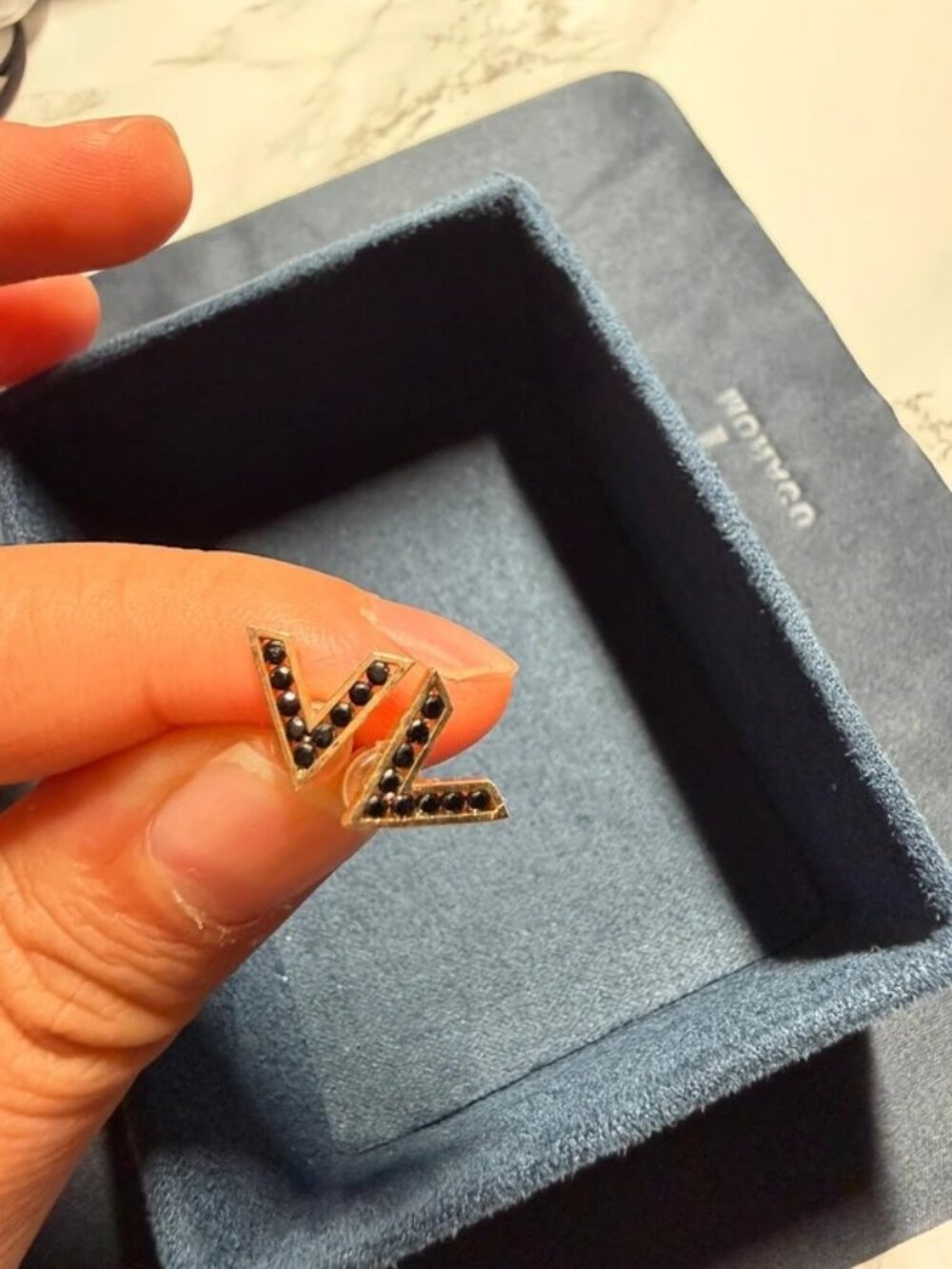 Gold chevron stud earring with black stones single